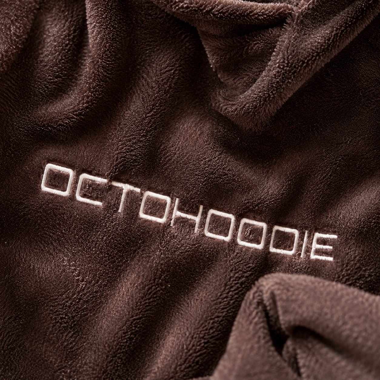 Brown fleece fabric with 'OCTOHOOIE' embroidered on it