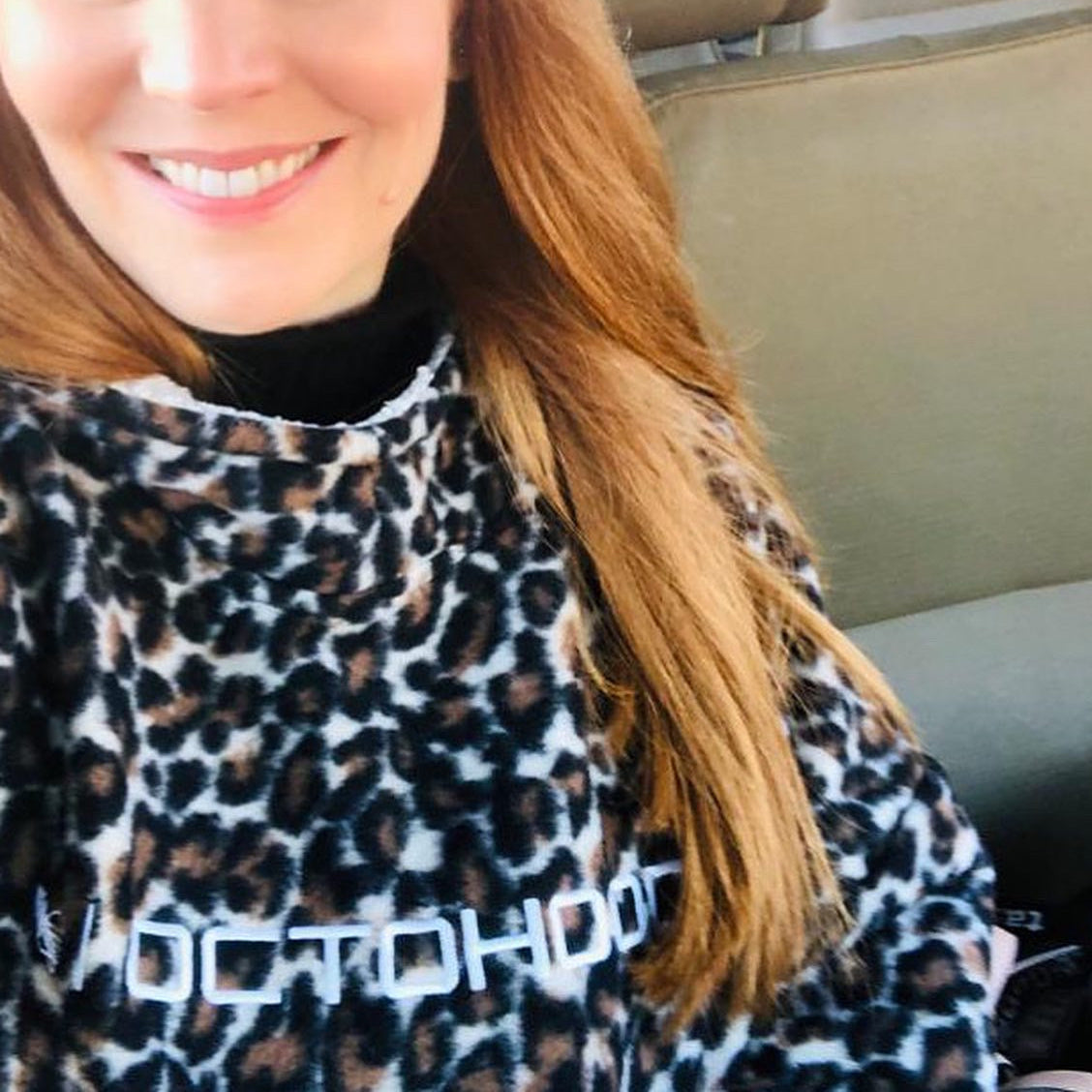 A woman on a Game Drive in South Africa wearing a Leopard print polar fleeceOctohoodie