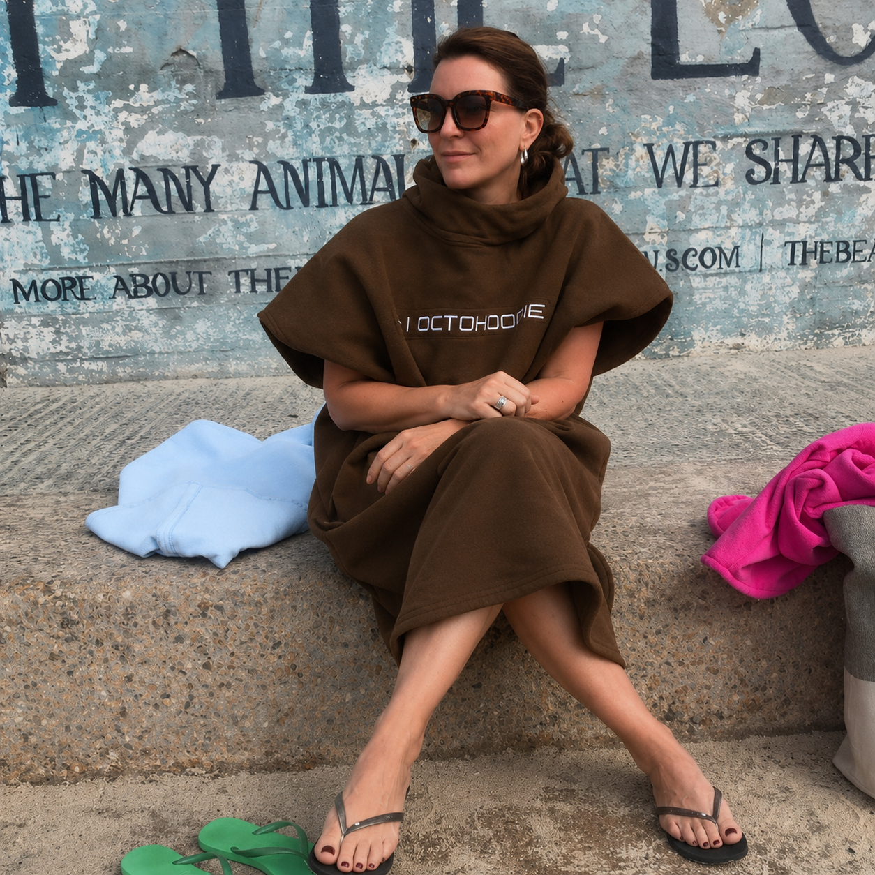 A woman wearing a chocolate bring short sleeve Octohoodie