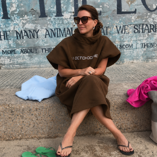 A woman wearing a chocolate bring short sleeve Octohoodie
