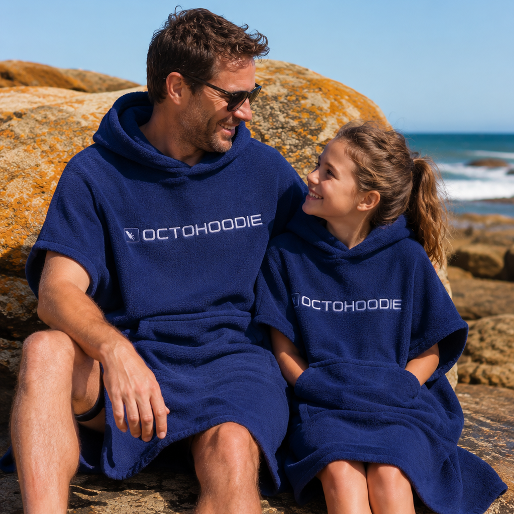 Father and daughter at the beach wearing navy short sleeve Octohoodie