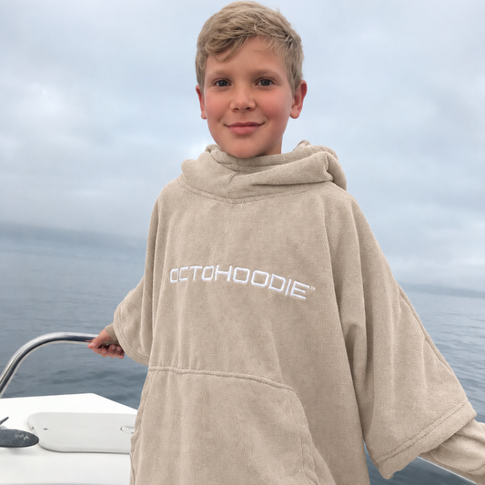 Boy on a boat wearing an Octohoodie