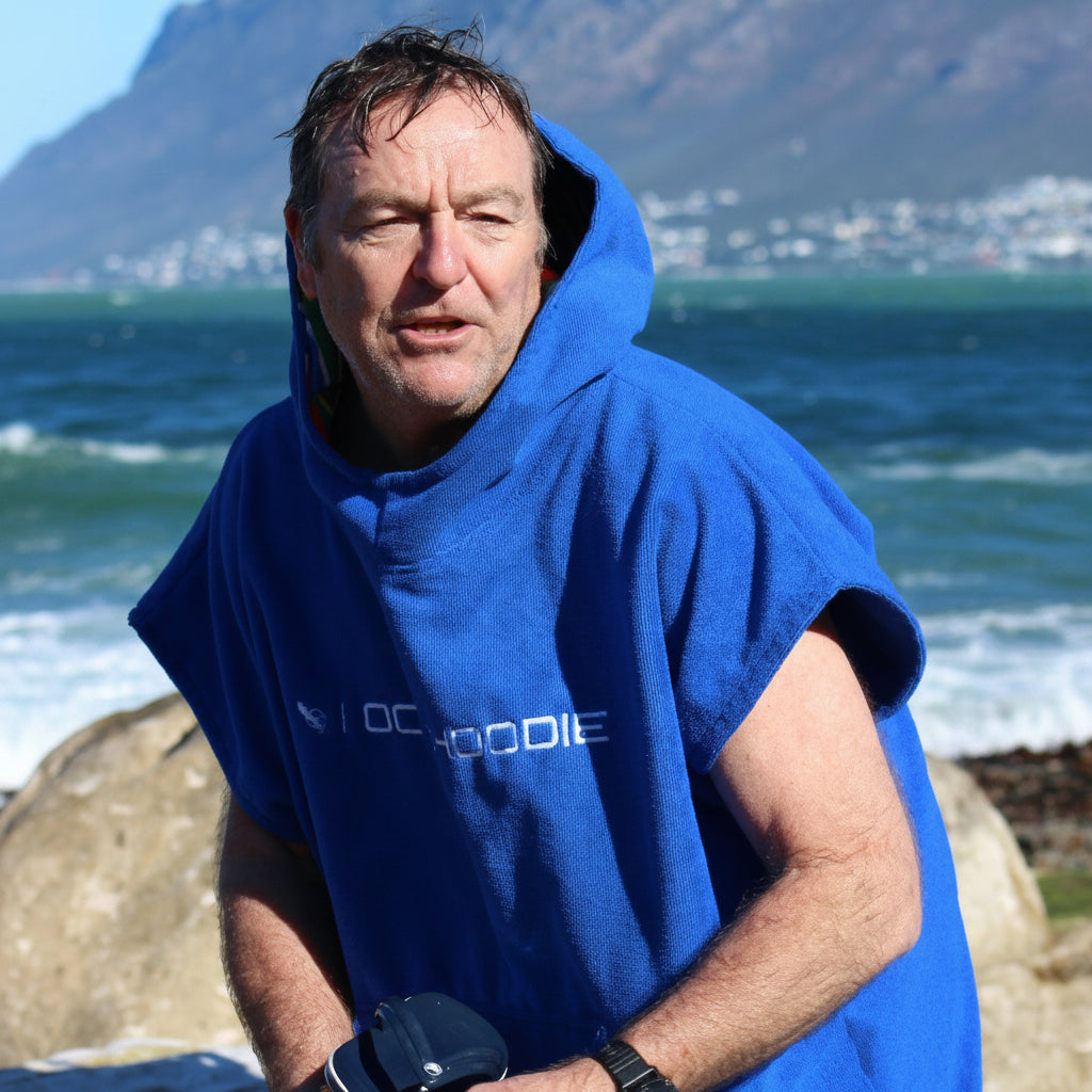 Person wearing an Ultramarine blue Octohoodie at the beach