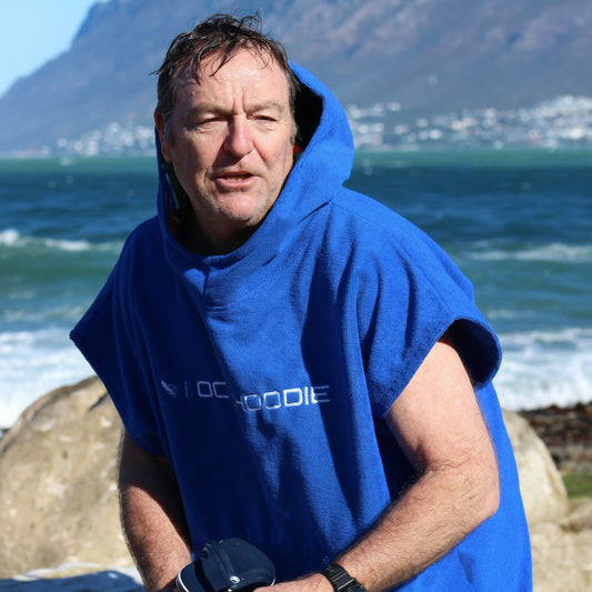 Person wearing an Ultramarine blue Octohoodie at the beach