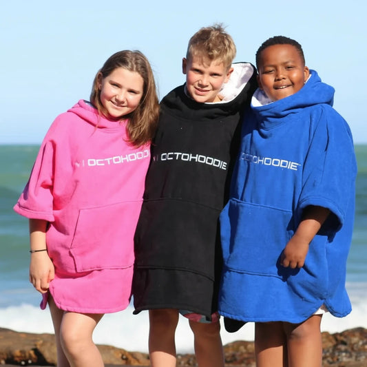 Kids in long-sleeved Octohoodies at tidal pool