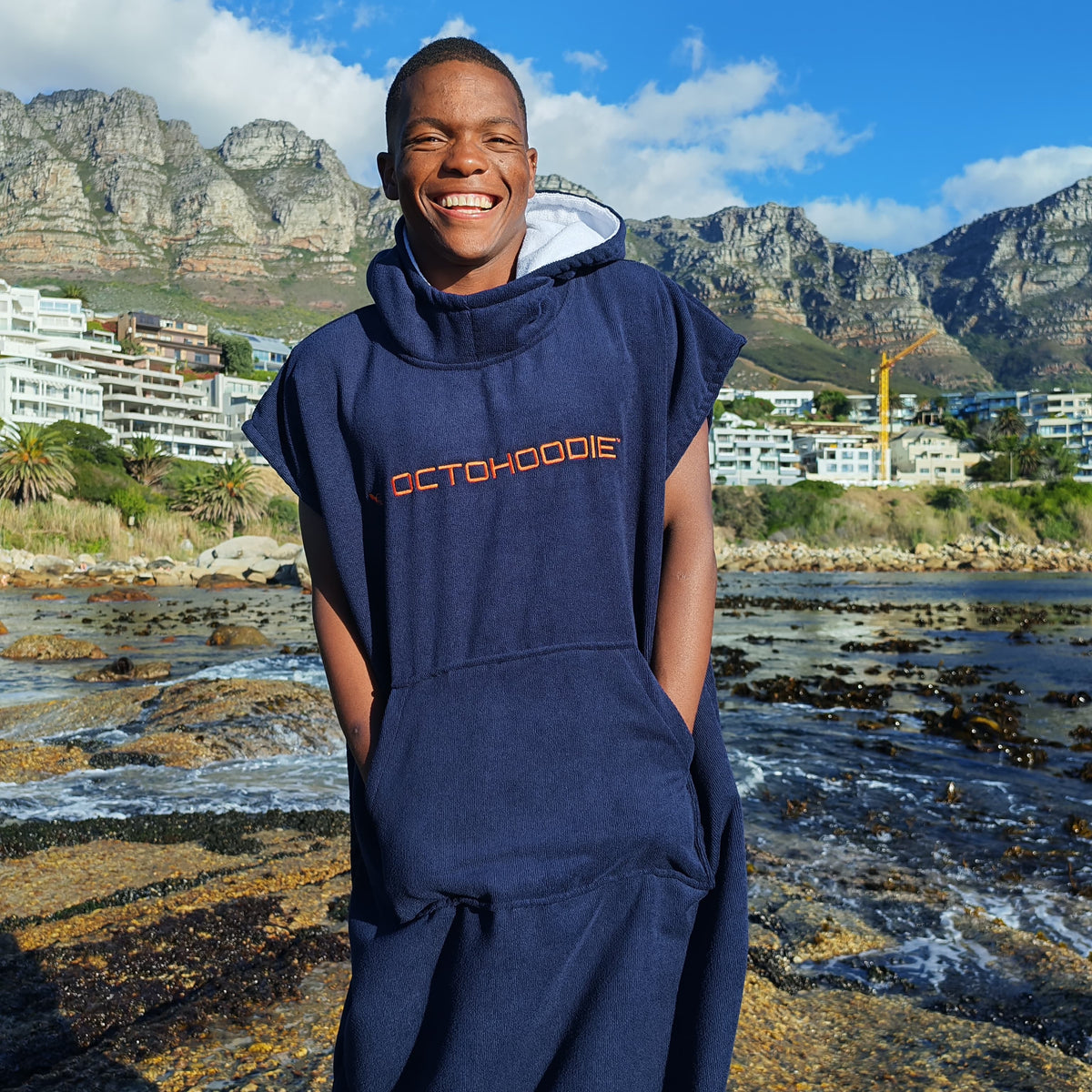 Atlantic Ember Navy with Orange logo Octohoodie on a swimmer in Cape Town