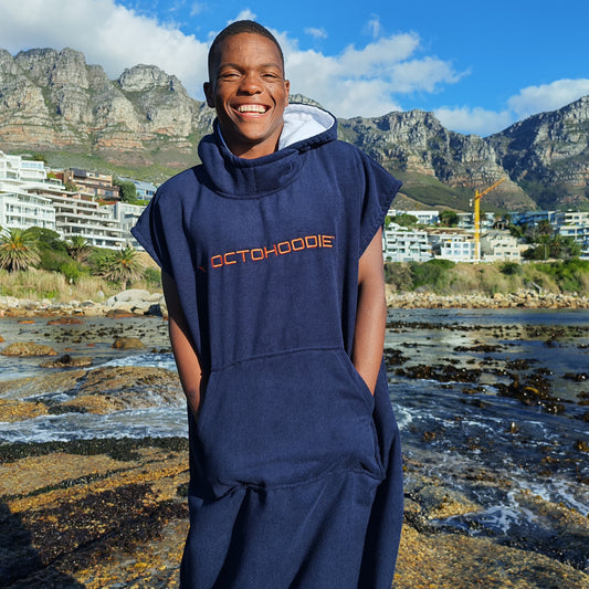 Atlantic Ember Navy with Orange logo Octohoodie on a swimmer in Cape Town